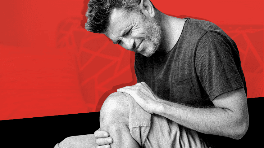 Man Holding Knee with Knee Pain Image